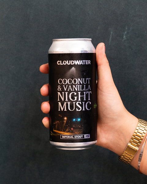 Night Music Imperial Stout, Coconut & Vanilla edition, in 440ml can being held by someone with a casio gold coloured watch