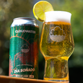 Cloudwater Dia Soñado Mexican Lager can and glass with a lime wedge outdoors