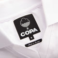 Close-up of inside collar label on Back of White Cloudwater Brew x COPA Retro Football Shirt sports jersey.