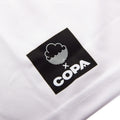 Close-up of front shirt label on Back of White Cloudwater Brew x COPA Retro Football Shirt sports jersey.