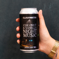 Night Music Imperial Stout, Coconut & Vanilla edition, in 440ml can being held by someone with a casio gold coloured watch