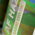 Close-up of a can with 'AF Haze Sabro Edition' text on a colorful background