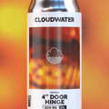 A can of Cloudwater 4" Door Hinge Double Dry-Hopped IPA, containing orange zest and hops that intensify the orangey flavour. The can features a white label with a fiery orange and red graphic, set against a warm, blurred orange background with a clear reflection below.