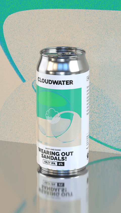 A silver aluminum can of Cloudwater 'Wearing Out Sandals!' Hazy & Dank IPA, featuring a white label with green and beige graphic elements, set against a stylized green and beige background with a clear reflection below.