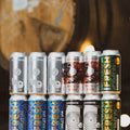A set of 12 Cloudwater 'AF' (Alcohol-Free) craft beer cans, part of the AF Flavour Of The Label' bundle. The bundle contains 3 cans of Fresh AF Hazy IPA, 2 cans of Fresh: Mosaic Edition AF Hazy IPA, 3 cans of Lo, low-alcohol lager, 2 cans of Tasty AF Cherry & Hibiscus AF Sour and 2 cans of Freska AF Stout