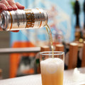 Cloudwater Piccadilly Pilsner, classic lager being poured from a can into a pint glass