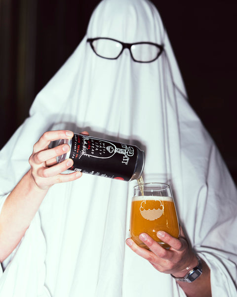 A spoOoOoOky ghost pouring West Coast IPA is Dead 2026, in collaboration with Green Cheek