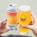 Person holding The Bird Of A Thousand Voices, 6% IPA by Cloudwater Brew Co, poured into a glass