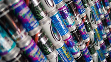 Lots of Cloudwater cans stacked and displayed at an angle