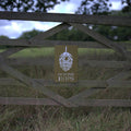 Hukins Hop farm in Kent, fence in a field with the Hukins Hop logo, a hop flower. Cloudwater Brew Co visited Hukins for their 2025 hop harvest and created a fresh hop beer with the Challenger variety
