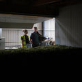 Mel Dyson of Cloudwater Brew Co, and Dave at Hukins Hop farm in Kent, looking into the machinery after the 2025 hop harvest. In the foreground is a veritable cornucopia of hop flowers. Cloudwater Brew Co visited Hukins for their 2025 hop harvest and created a fresh hop beer with the Challenger variety