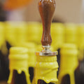 Adding an embossed Cloudwater logo to the wax dipped bottle of Stellae Radius. A Barrel-Aged Imperial Stout with Banana, Coconut, Vanilla and Cinnamon brewed and aged by Cloudwater in collaboration with Elmeleven