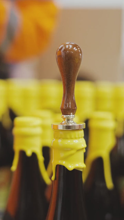 Adding an embossed Cloudwater logo to the wax dipped bottle of Stellae Radius. A Barrel-Aged Imperial Stout with Banana, Coconut, Vanilla and Cinnamon brewed and aged by Cloudwater in collaboration with Elmeleven